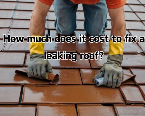 A worker applies sealant to a leaking roof