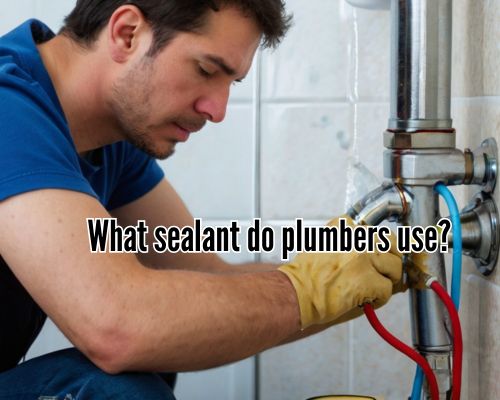 Focused plumber sealing a pipe leak.