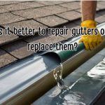Man fixing leaking roof gutter.