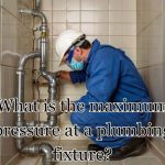 a plumber checking out pipe pressure